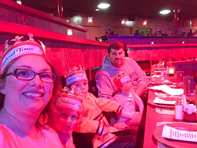 A family seated at Medieval Times.