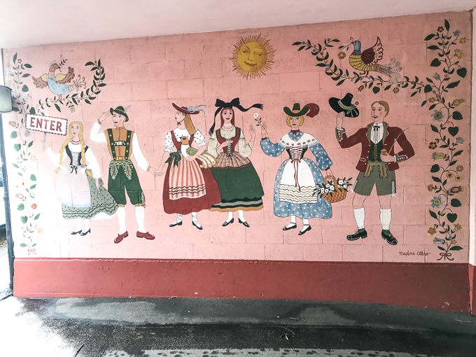 A colorful mural painted in the front driveway of Hofsas House.