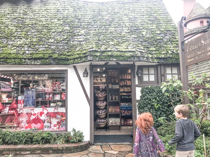 Two kids standing in from of Cottage of Sweets in Carmel.