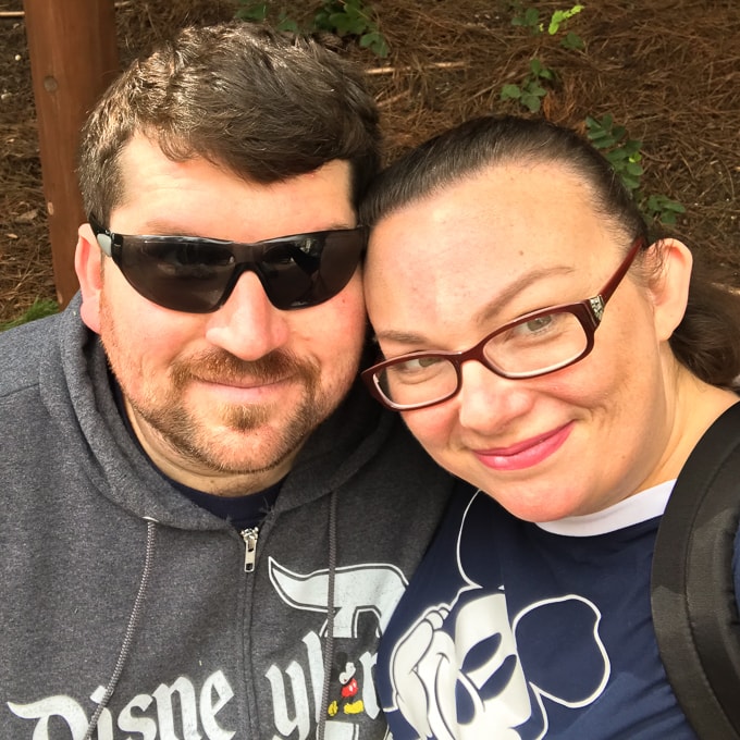 A man and women taking a selfie during their trip to Disneyland in Winter.