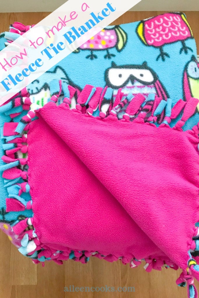 Pink and blue fleece tie blanket with owls.