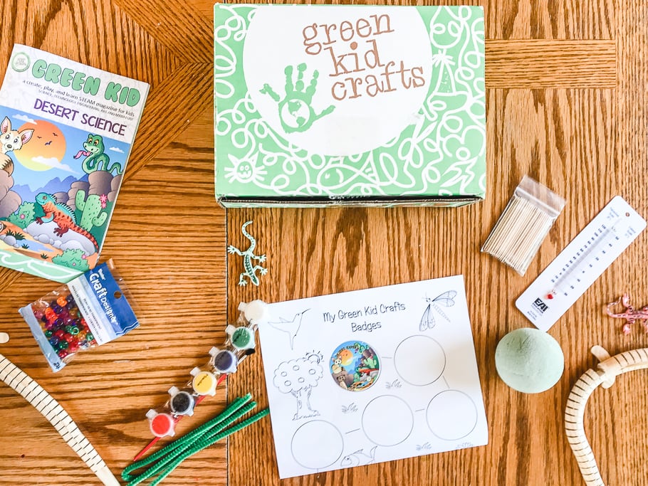 A flat lay of the green kid crafts subscription box and its contents. 