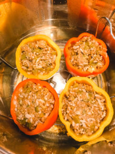 taco stuffed peppers inside an instant pot.