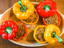 4 instant pot taco stuffed peppers in a serving dish.