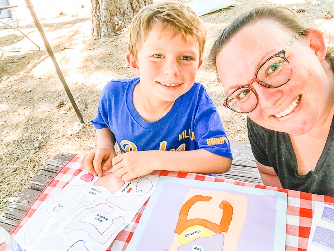 A mother and son working on the Green Kid Crafts Human Body Lab together.