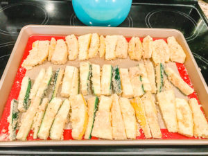Parmesan zucchini fries ready to be baked.