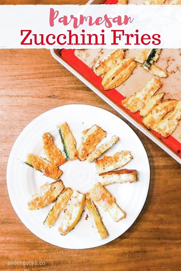 Parmesan zucchini fries on a white plate.