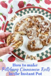 A hand pulling a cinnamon roll from a batch of rolls with the words "how to make pillsbury cinnamon rolls in the instant pot".