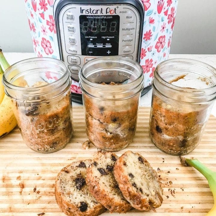 A round loaf of instant pot banana bread cut into three slices.