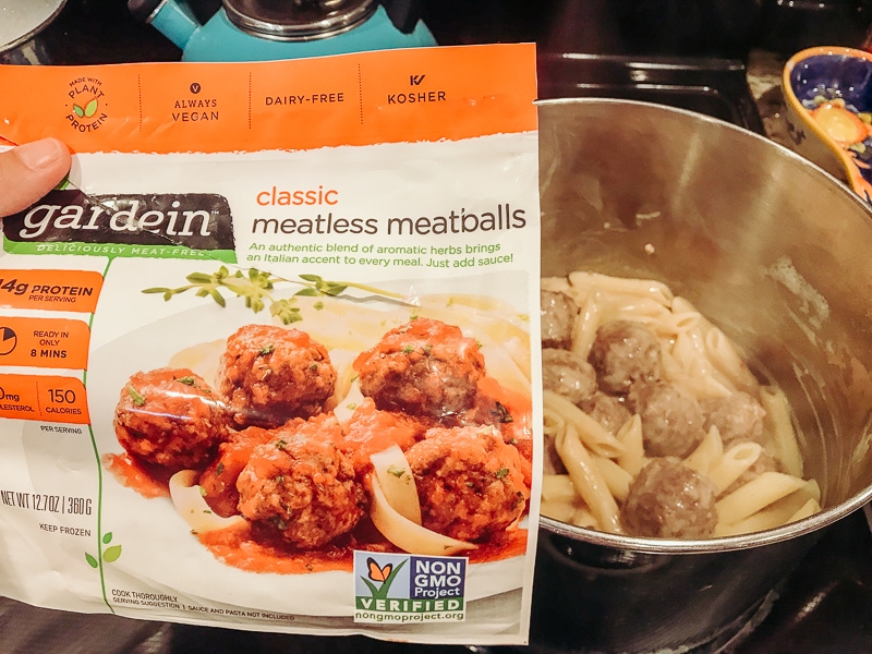 A bag of Gardien meatless meatballs in front of a pot.