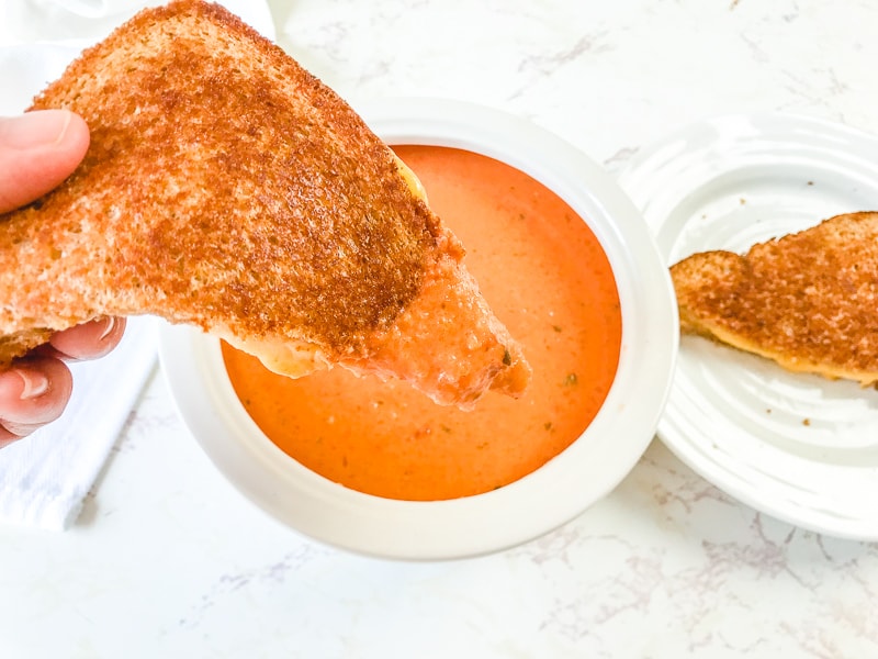 A grilled cheese dipped into the creamy tomato basil soup recipe/
