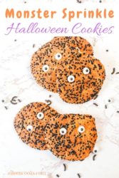 Halloween cookies covered in orange and black sprinkles.