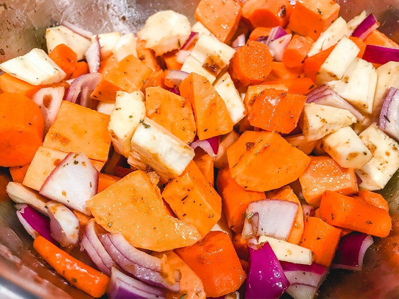 Root vegetables cut into chunks and tossed in olive oil mixture.