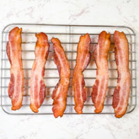 Air fryer bacon on a cooling rack.