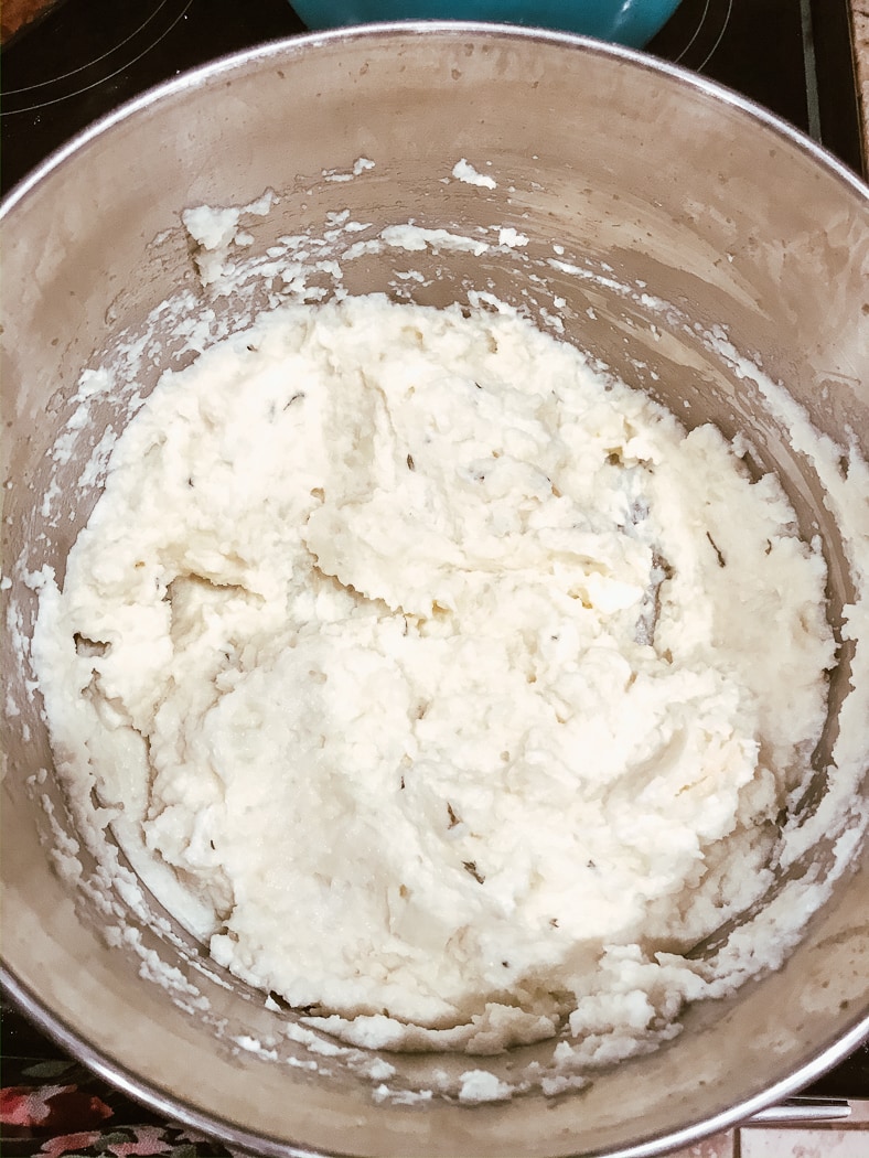 Keto cauliflower mashed potatoes freshly made and still in the pot.