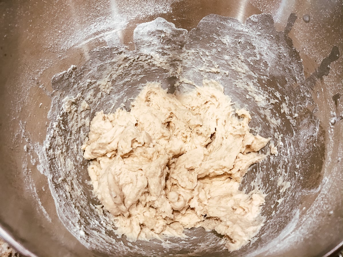 A scraggly ball of dough inside a bowl.