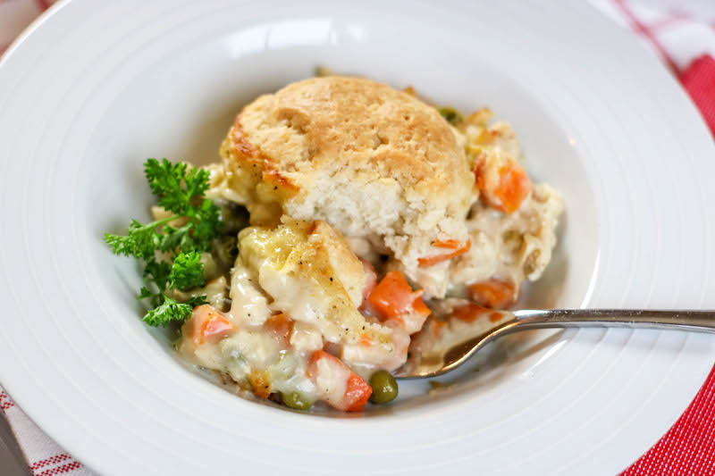 A bite of chicken pot pie on a fork.