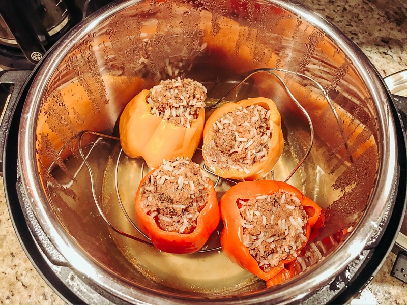 Cooked stuffed peppers inside instant pot.