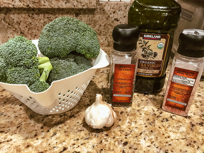Ingredients on counter for roasted broccoli with garlic.