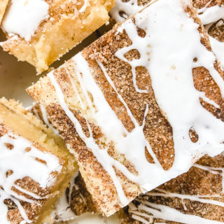 Close up of snickerdoodle bars with icing.