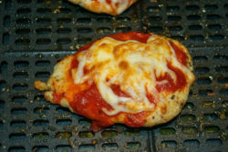 Cooked chicken parmesan in air fryer.
