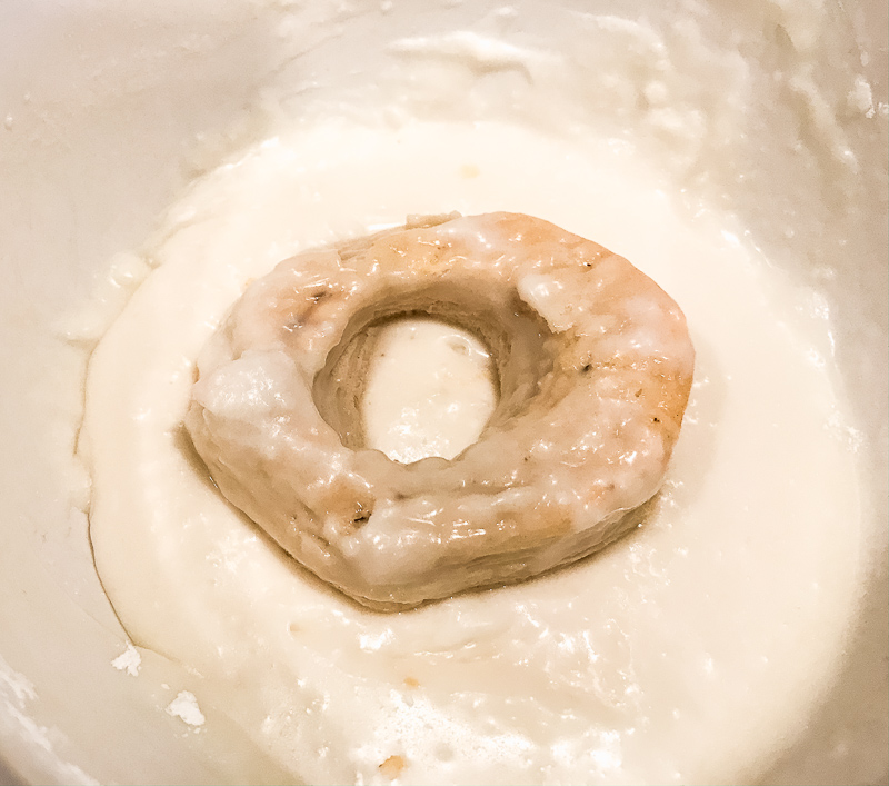 A donut dipped in a glaze.