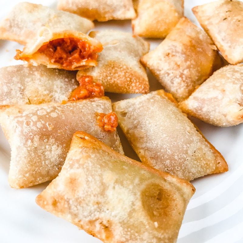 Close up of air fryer frozen pizza rolls freshly cooked.