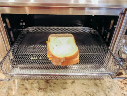Built grilled cheese on air fryer tray.