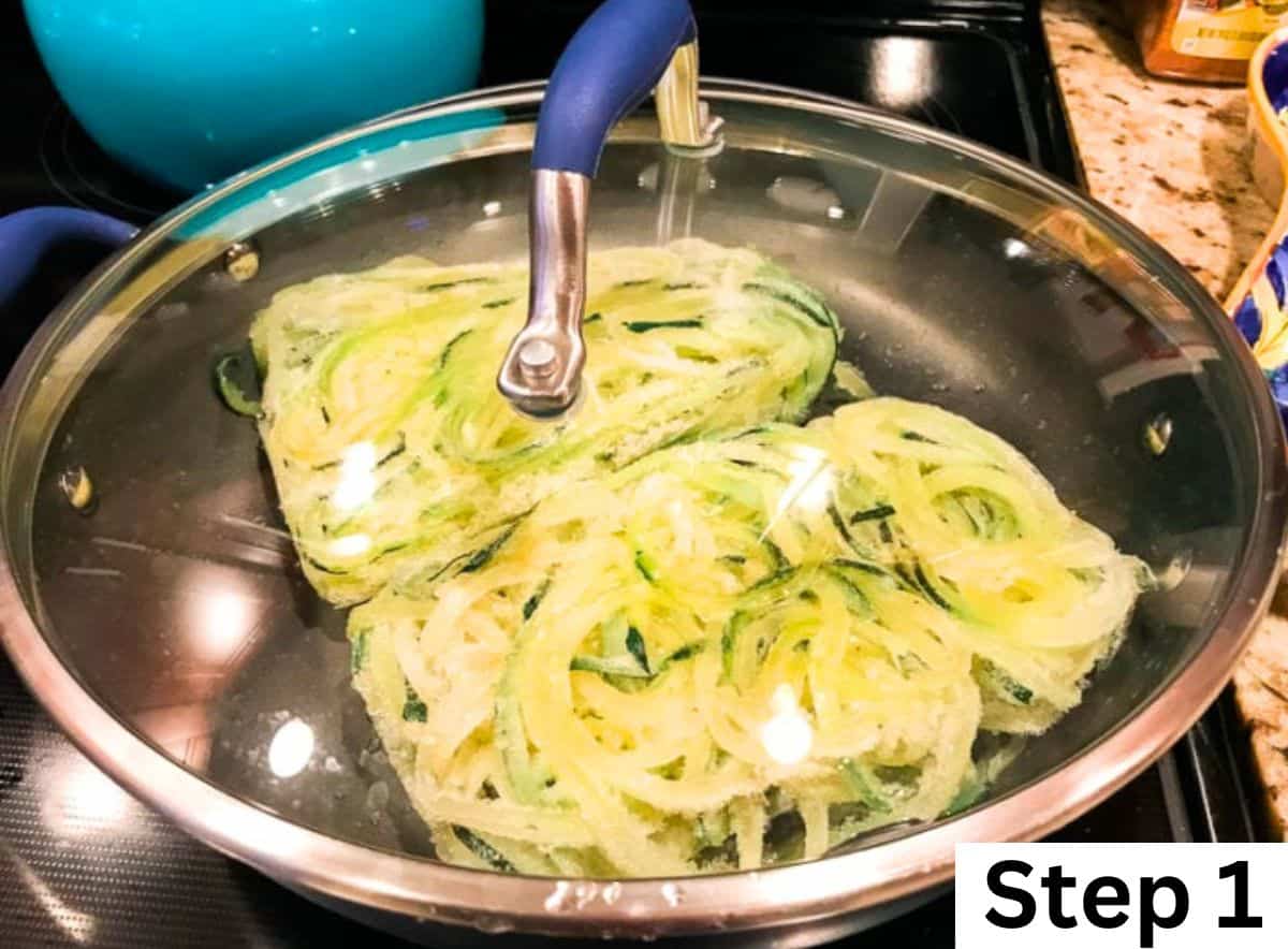 Two blocks of frozen zucchini noodles in a pan covered with a glass lid.