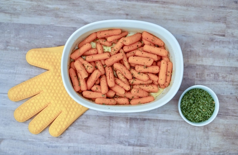 Roasted buttered carrots sprinkled with parsley.