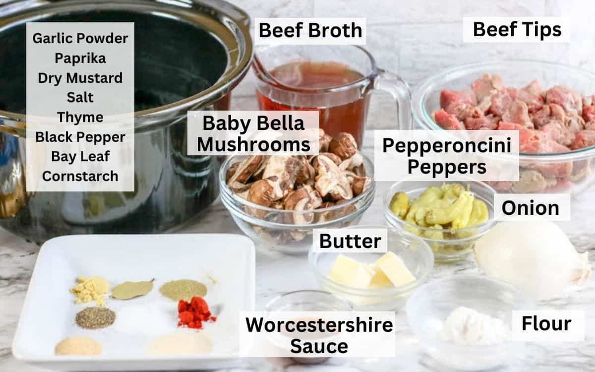The ingredients for crockpot beef tips laid out on a marble countertop.