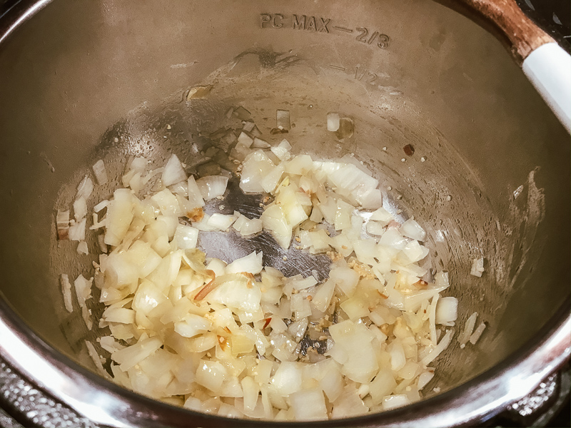 Onion cooking inside instant pot.
