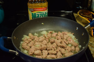 Sausage and onion in large skillet.
