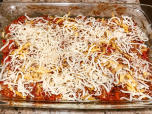 Cheese sprinkled on top of casserole.