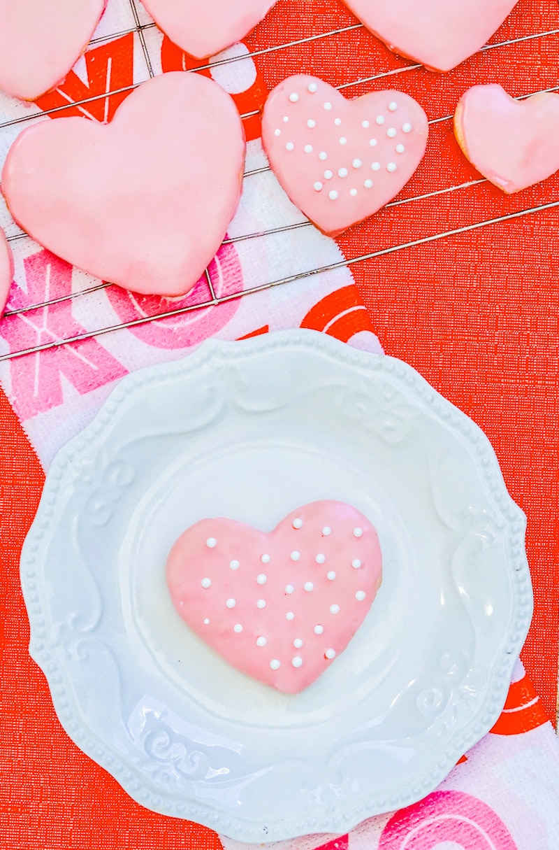 Valentine's Day cookie on a white plate.