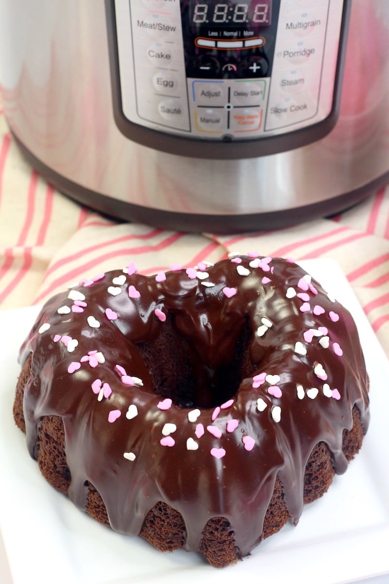 Heart shaped chocolate cake in front of instant pot.