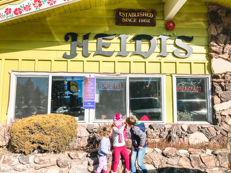 Three kids standing in front of Heidi's Pancake House in South Lake Tahoe.