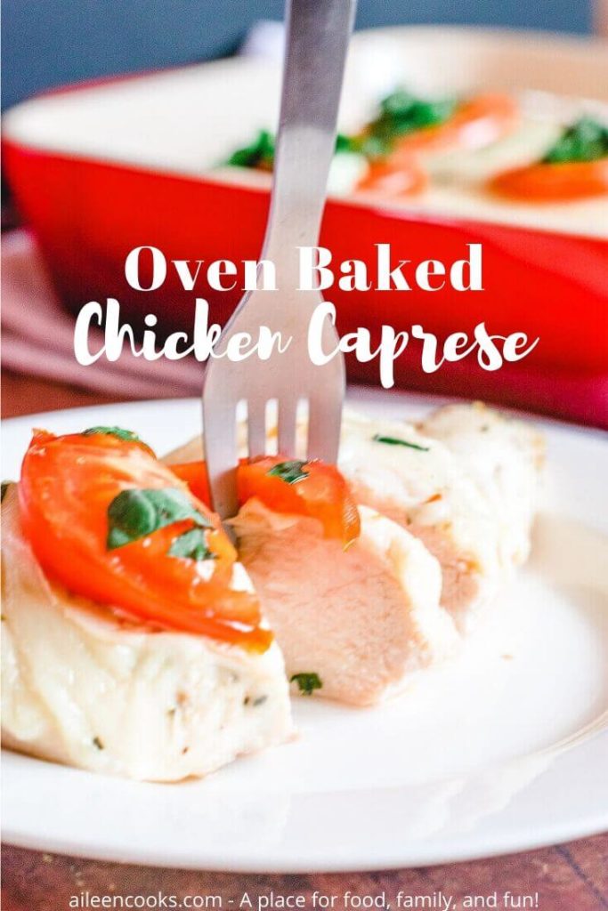 A fork sticking into a slice of chicken caprese and the words "oven baked chicken caprese" in white letters.