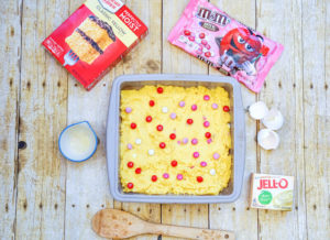 Baked cookie bars inside square baking dish.