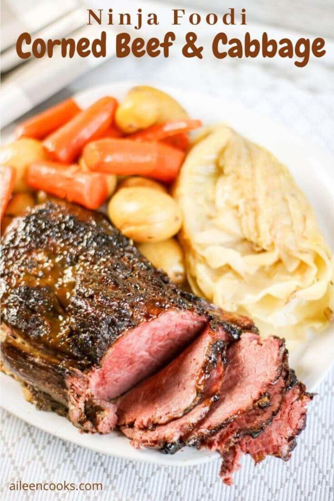 Close up of platter of corned beef, cabbage, potatoes, and carrots.