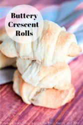 A stack of three crescent rolls with the words "buttery crescent rolls" in black lettering.