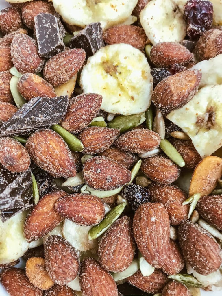Close up of spicy trail mix with banana chips and dark chocolate.