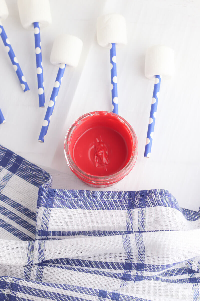 A small bowl of melted red candy melts 