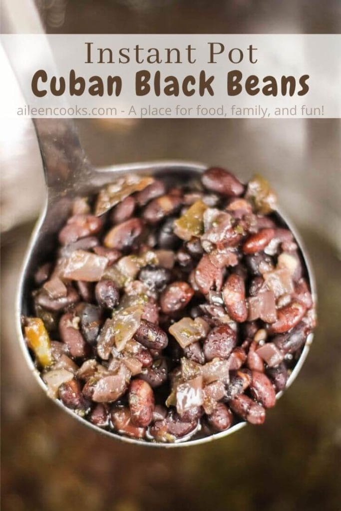 A ladle holding up a scoop of cuban black beans with the words "instant pot cuban black beans" in brown lettering.