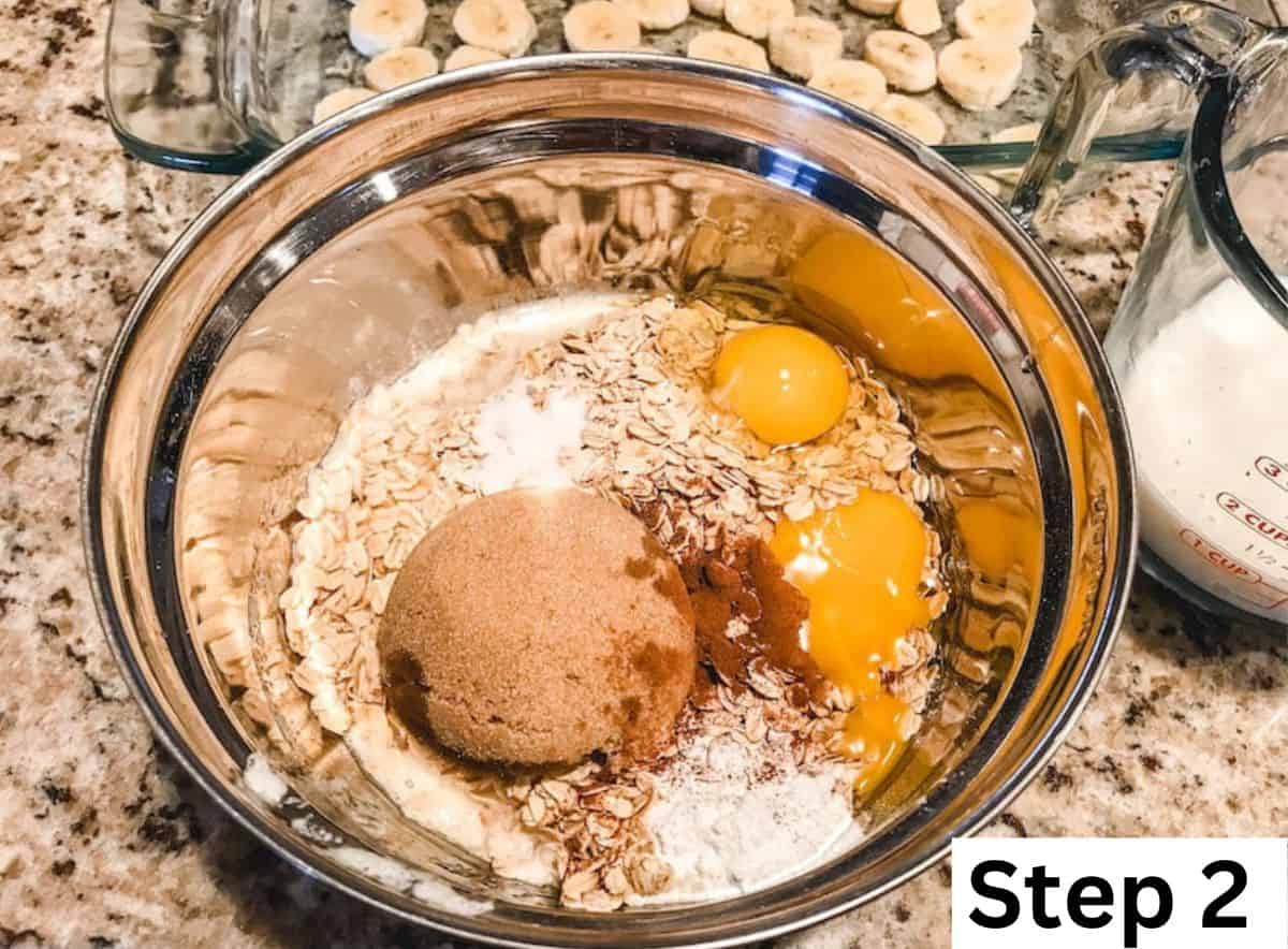 A metal bowl filled with ingredients for baked oatmeal.
