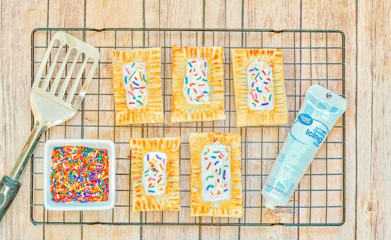 Iced pop tarts on a cooling rack.
