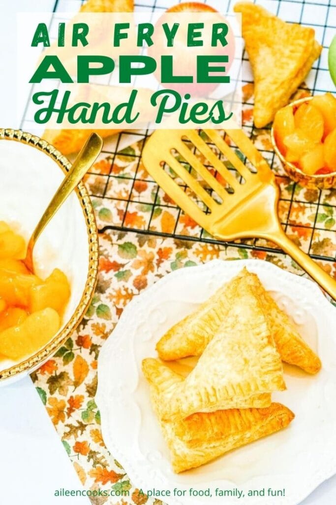 A plate of hand pies next to a cooling rack of hand pies with the words "air fryer apple hand pies" in green lettering.