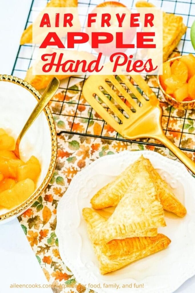 A plate of apple turnovers with the words "air fryer apple hand pies" in red lettering.