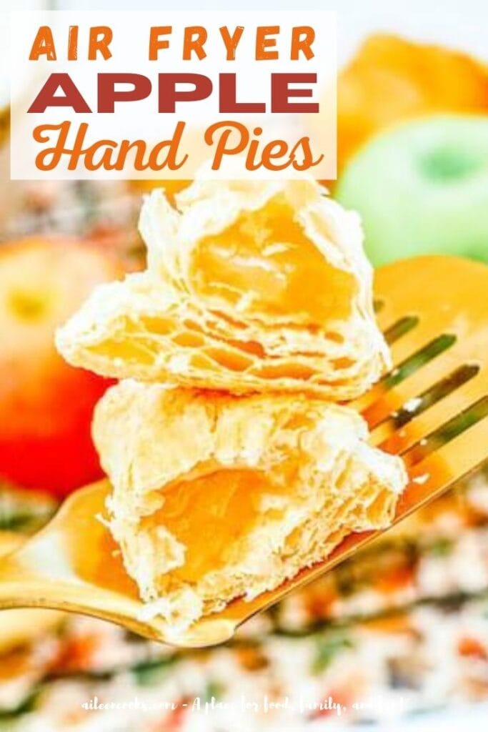 A stack of apple hand pies cut in half with the words "air fryer apple hand pies" in orange and purple lettering.