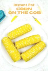Overhead shot of corn on the cob on a white plate with the words "instant pot corn on the cob'" in yellow letters.